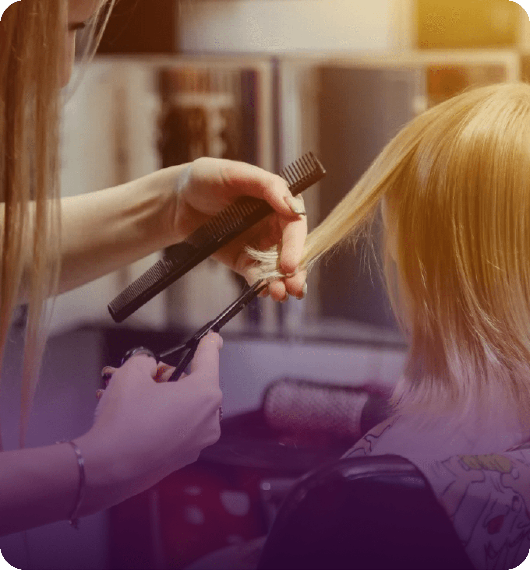 Stylist cutting a client’s hair at a salon