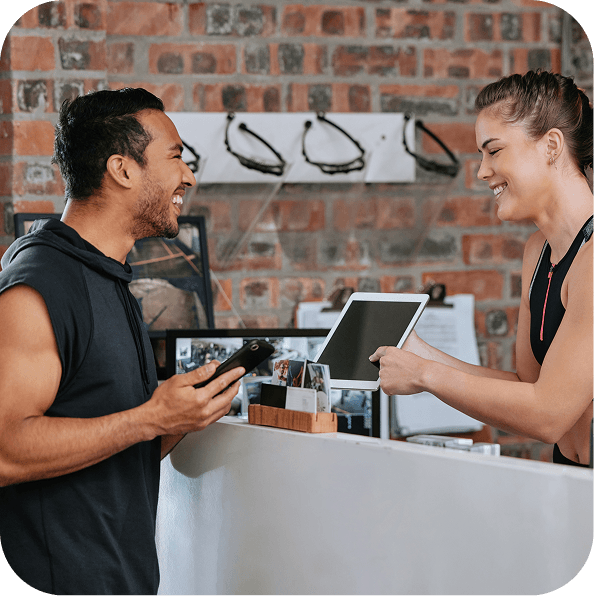 Customer earning a digital stamp at a Gym Front Desk